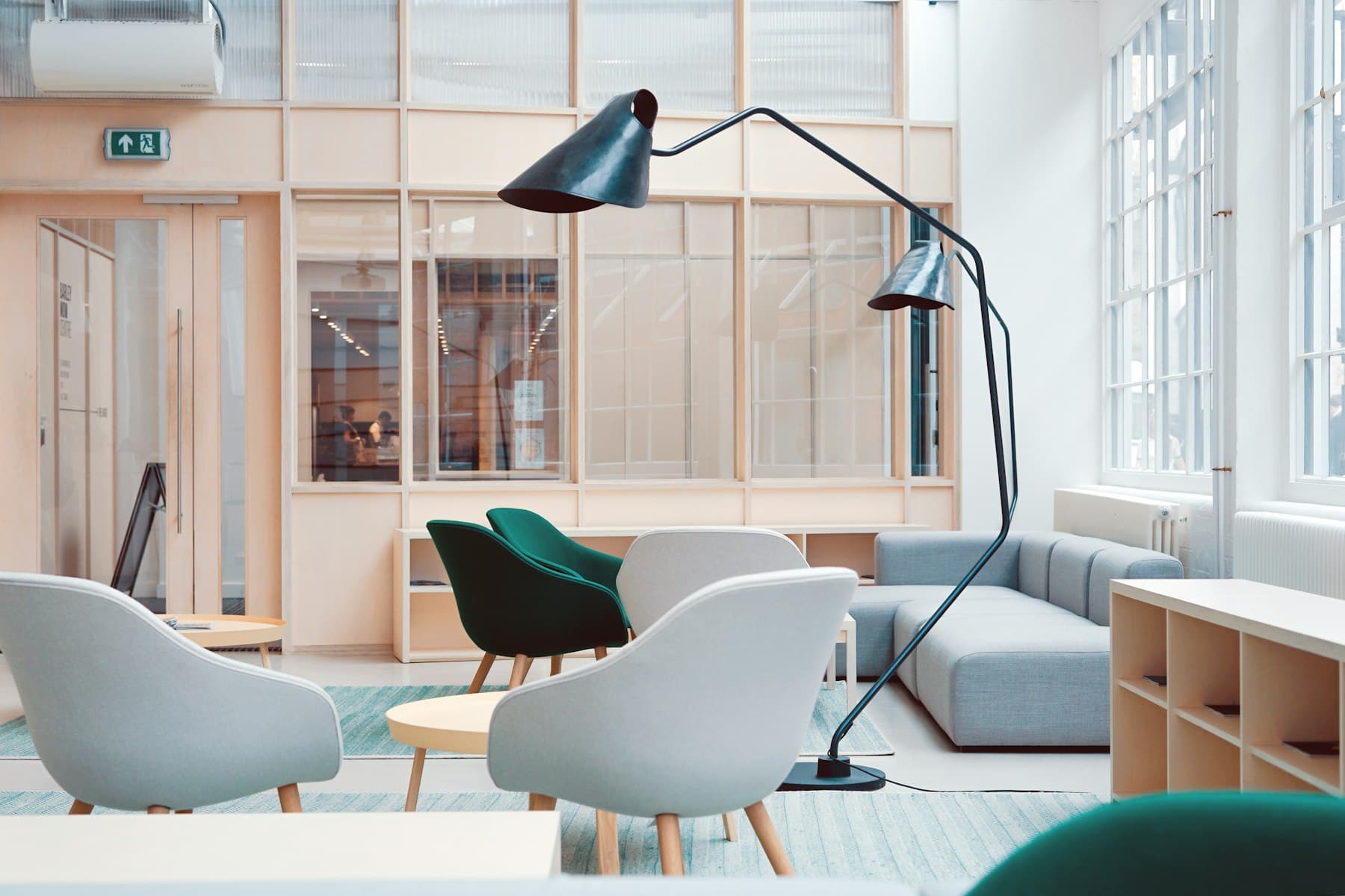 A quiet living room with a chair facing a window